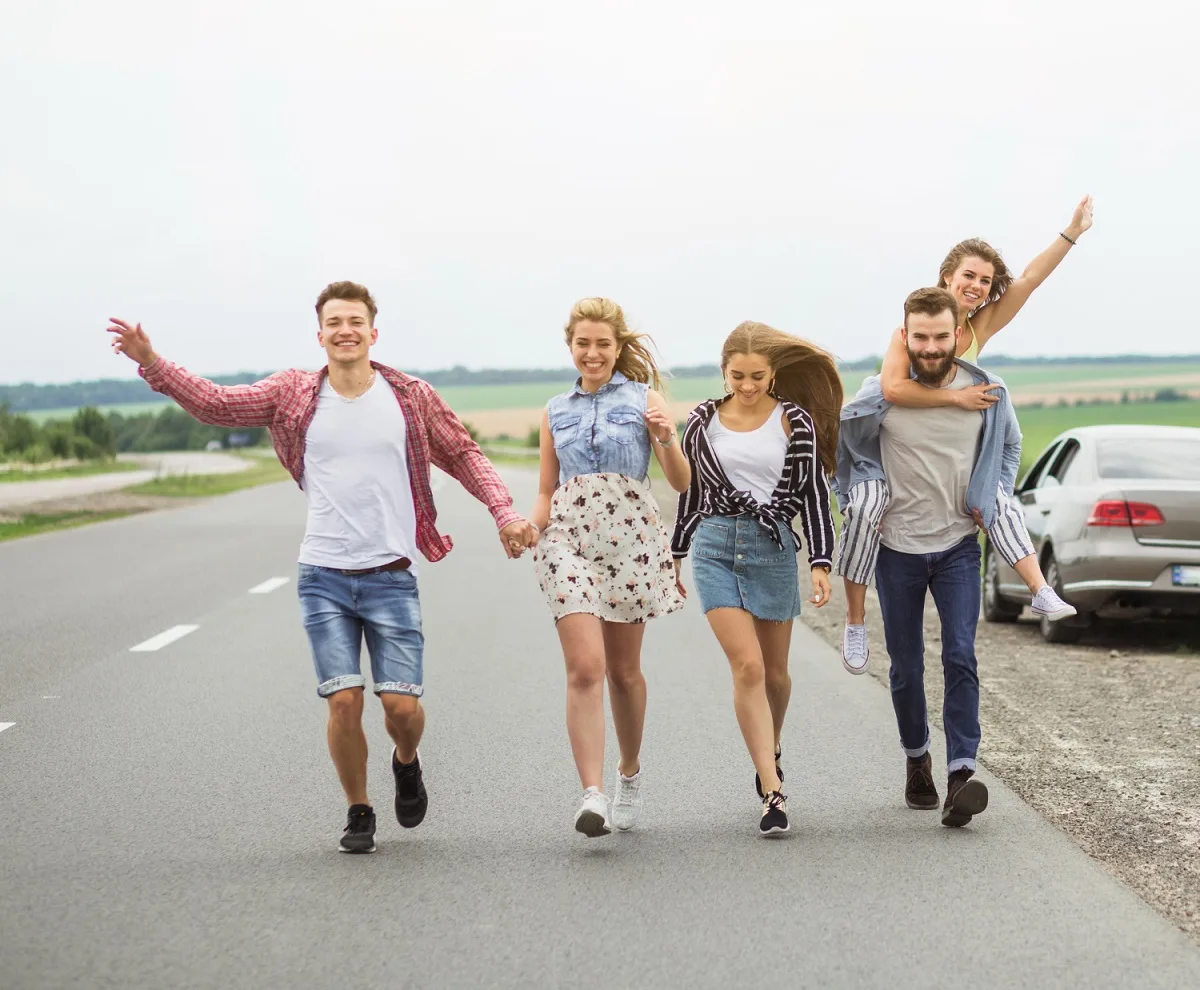 Happy Friends walking on road