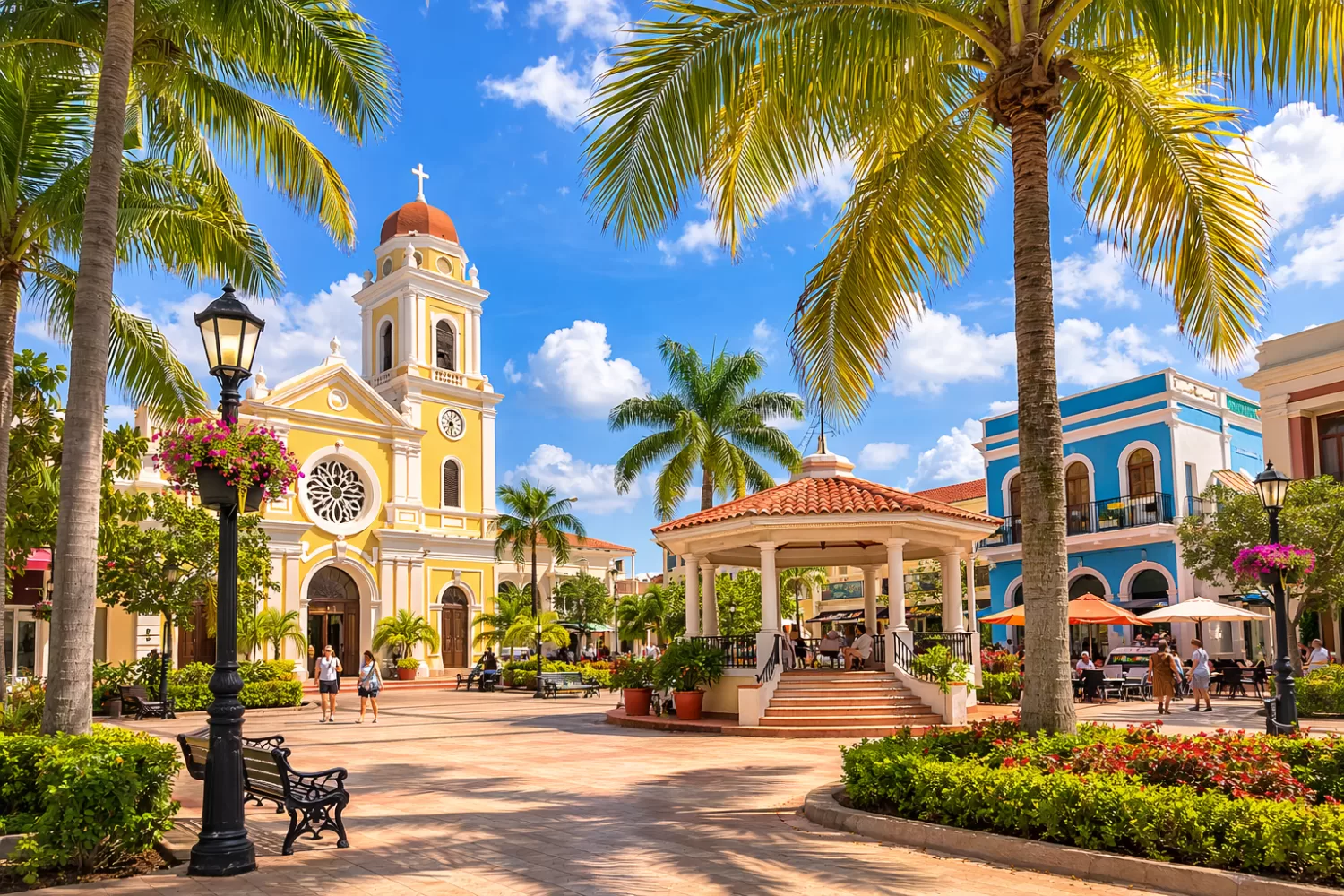 Parque Colon town square in Aguadilla Puerto Rico with historic buildings and palm trees